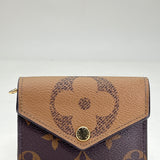 Zoe Reverse Compact Wallet in Monogram coated canvas, Gold Hardware