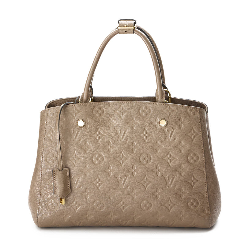 Montaigne MM Top handle bag in Monogram Empreinte leather, Gold Hardwa