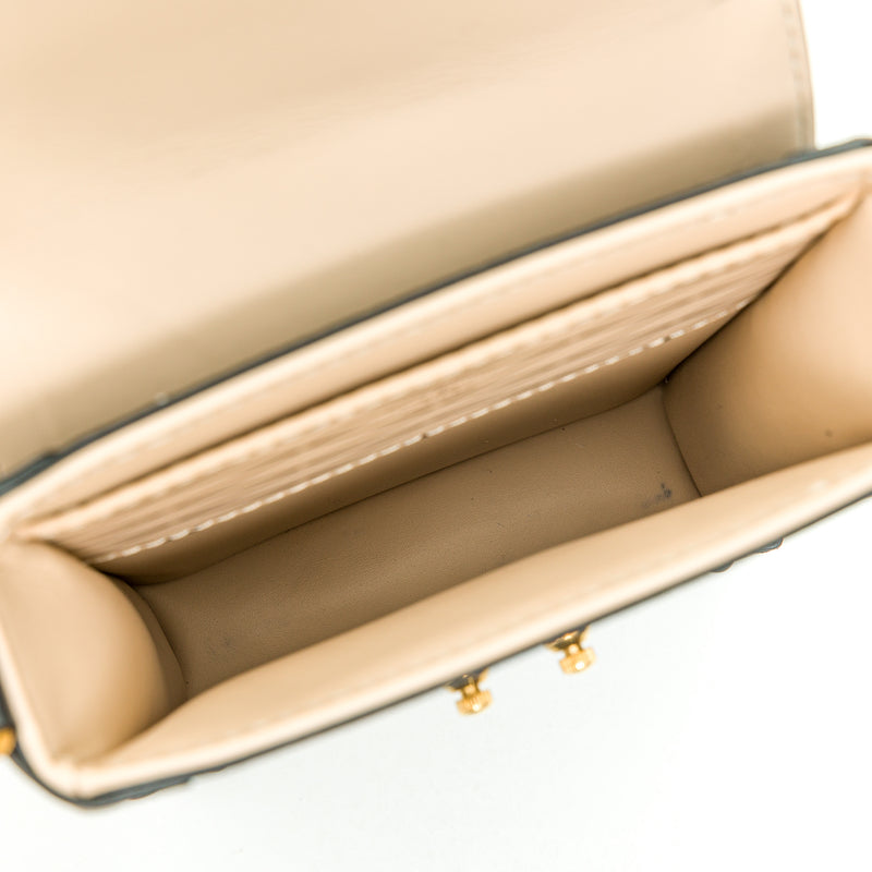 Vertical trunk Mini Crossbody bag in Monogram coated canvas, Gold Hardware