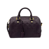 Speedy Bandouliere 25 Top handle bag in Monogram Empreinte leather, Gold Hardware
