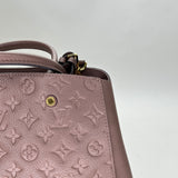 Montaigne MM Top handle bag in Monogram Empreinte leather, Gold Hardware
