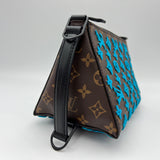 Tuffetage Triangle Messenger bag in Monogram coated canvas, Lacquered Metal Hardware