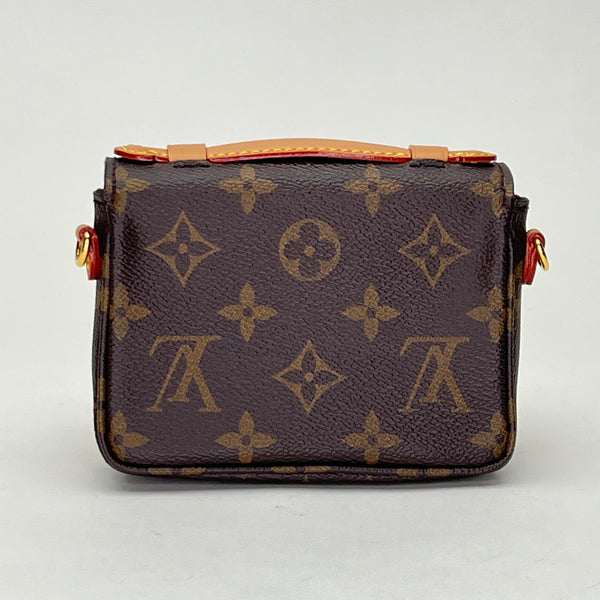 Metis Micro Coin purse in Monogram coated canvas, Gold Hardware